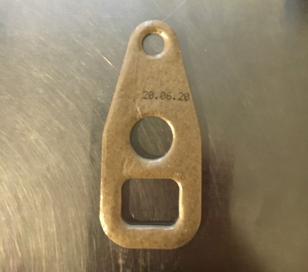Vintage-style bottle opener with imprinted date