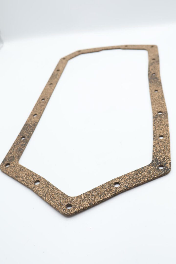 Cork gasket with bolt holes