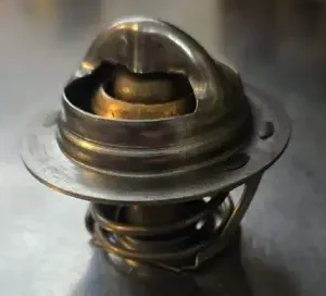 Metal thermostat component