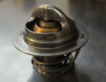 Metal thermostat component