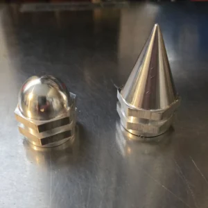 Two polished metal nuts, different shapes