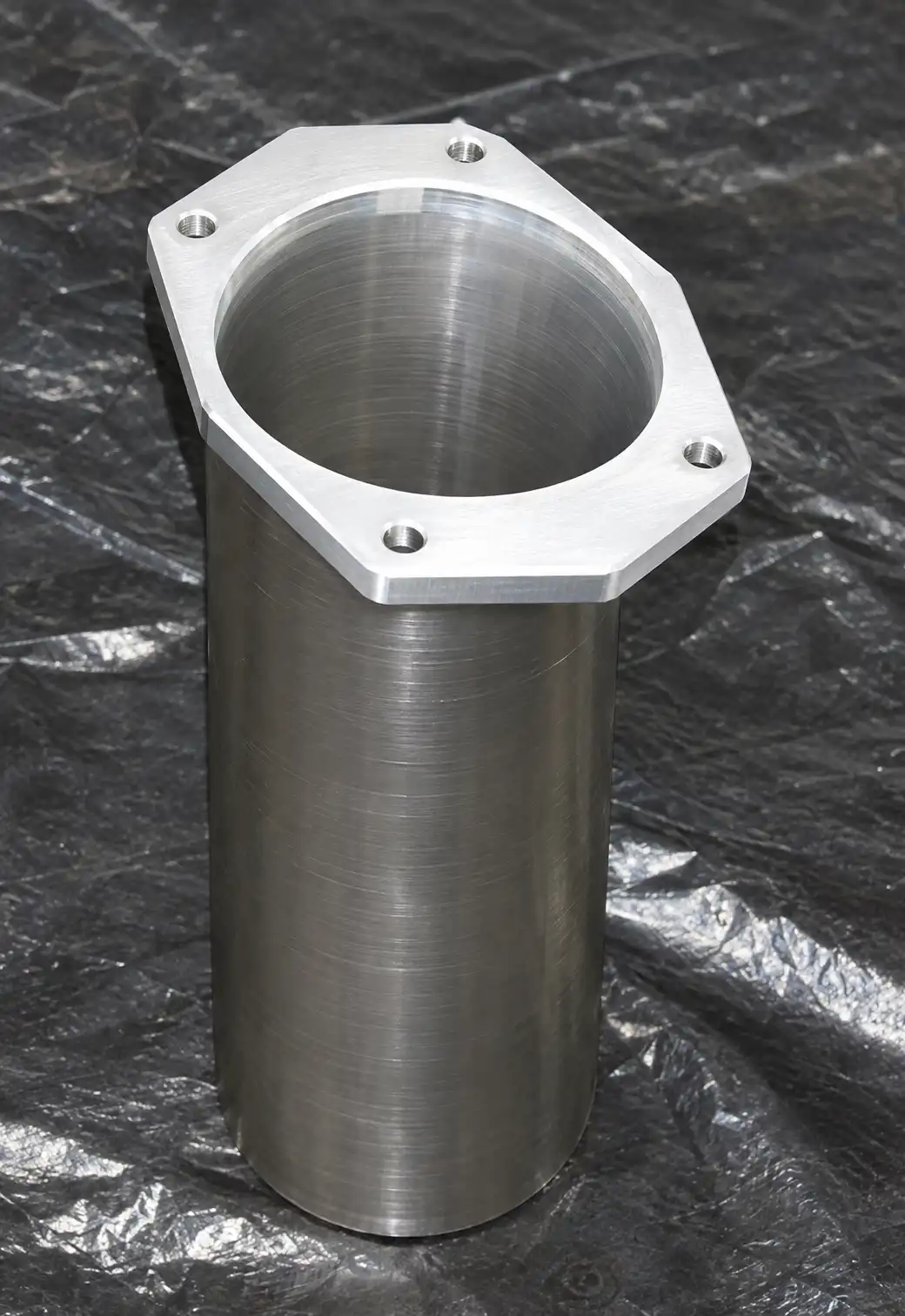 Machined aluminum cylinder with flange